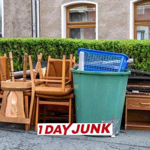 Discarded chairs, furniture, and trash bin on street before professional junk removal service by 1DayJunk