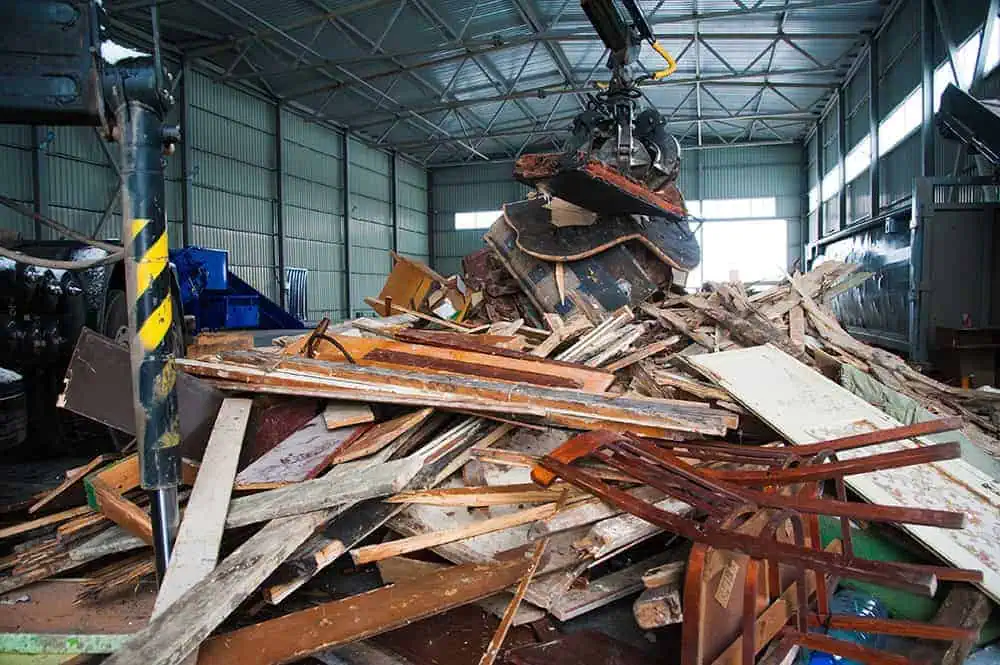 Industrial facility sorting construction debris with heavy machinery